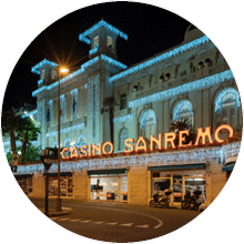 Sanremo, Italy - March 19, 2019: Facade view by night of the Municipal Casino in Sanremo, built in 1905, is an example of liberty style building